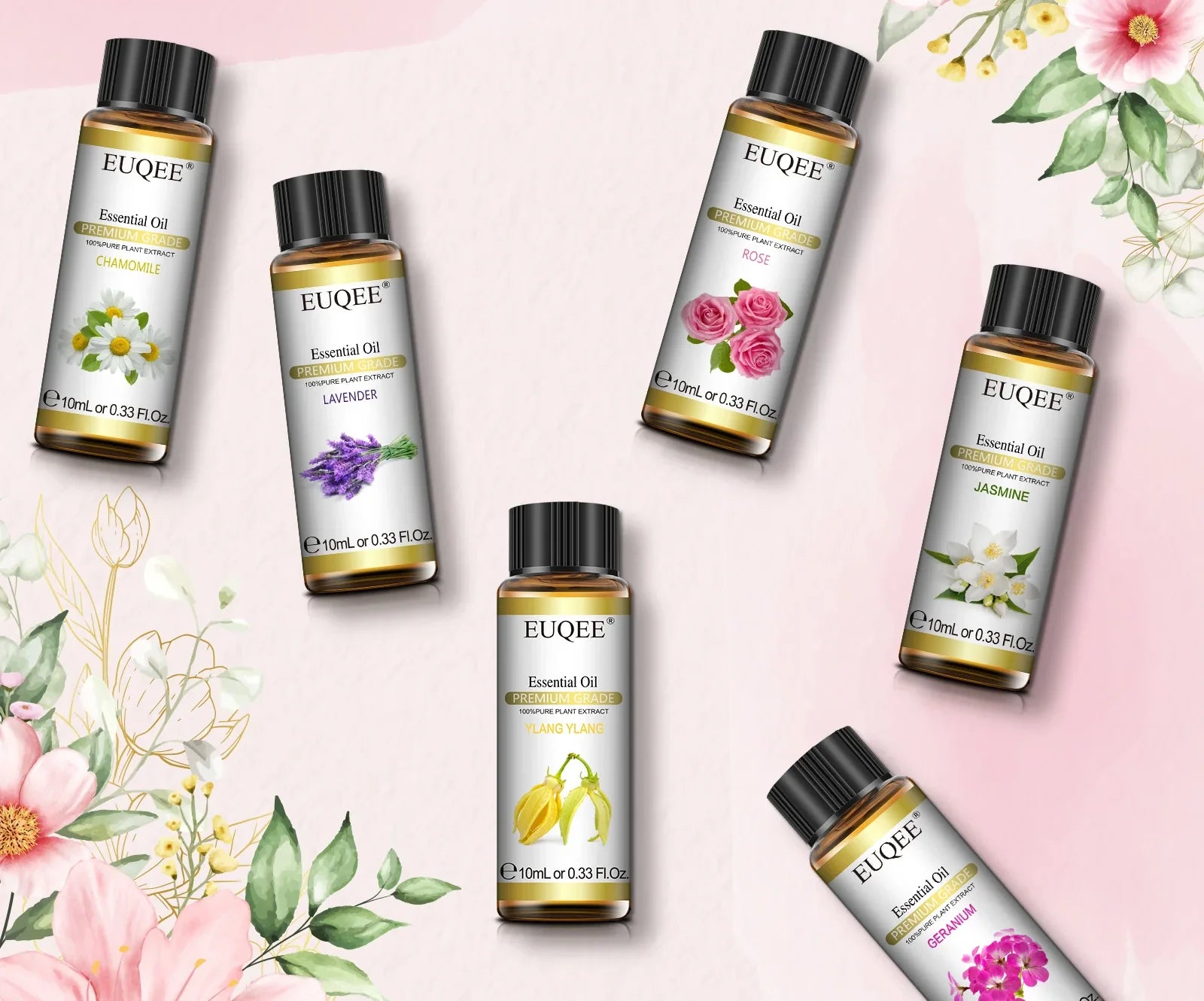 Les six flacons d'huiles essentielles du coffret BRAISE disposés sur fond floral
