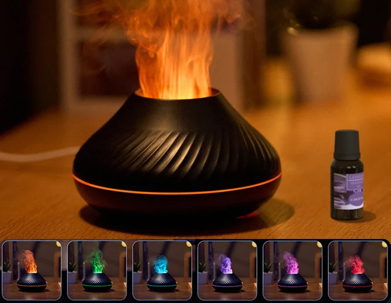 Diffuseur BRAISE Volcan noir, flamme orange et flacon d'huile essentielle sur une table en bois